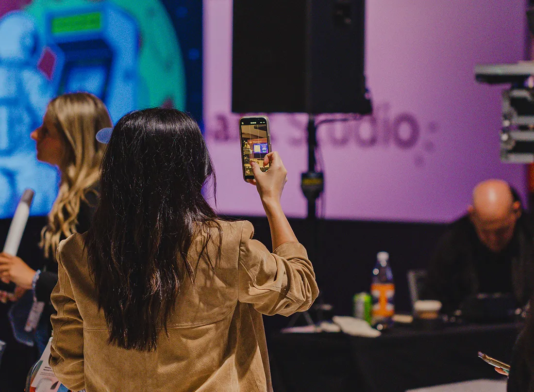 woman using her smart phone to scan a qr code at event
