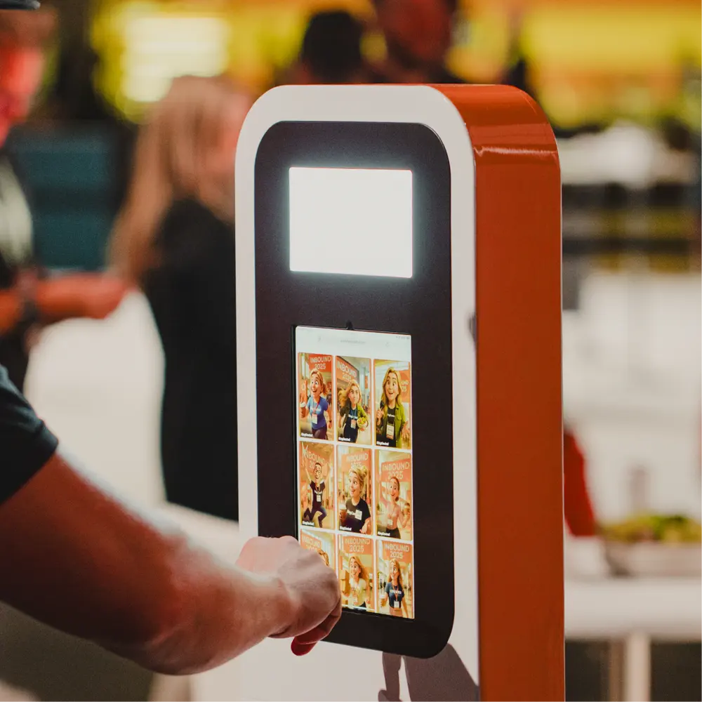 Event attendee using a browser-based photo booth kiosk to capture branded photos