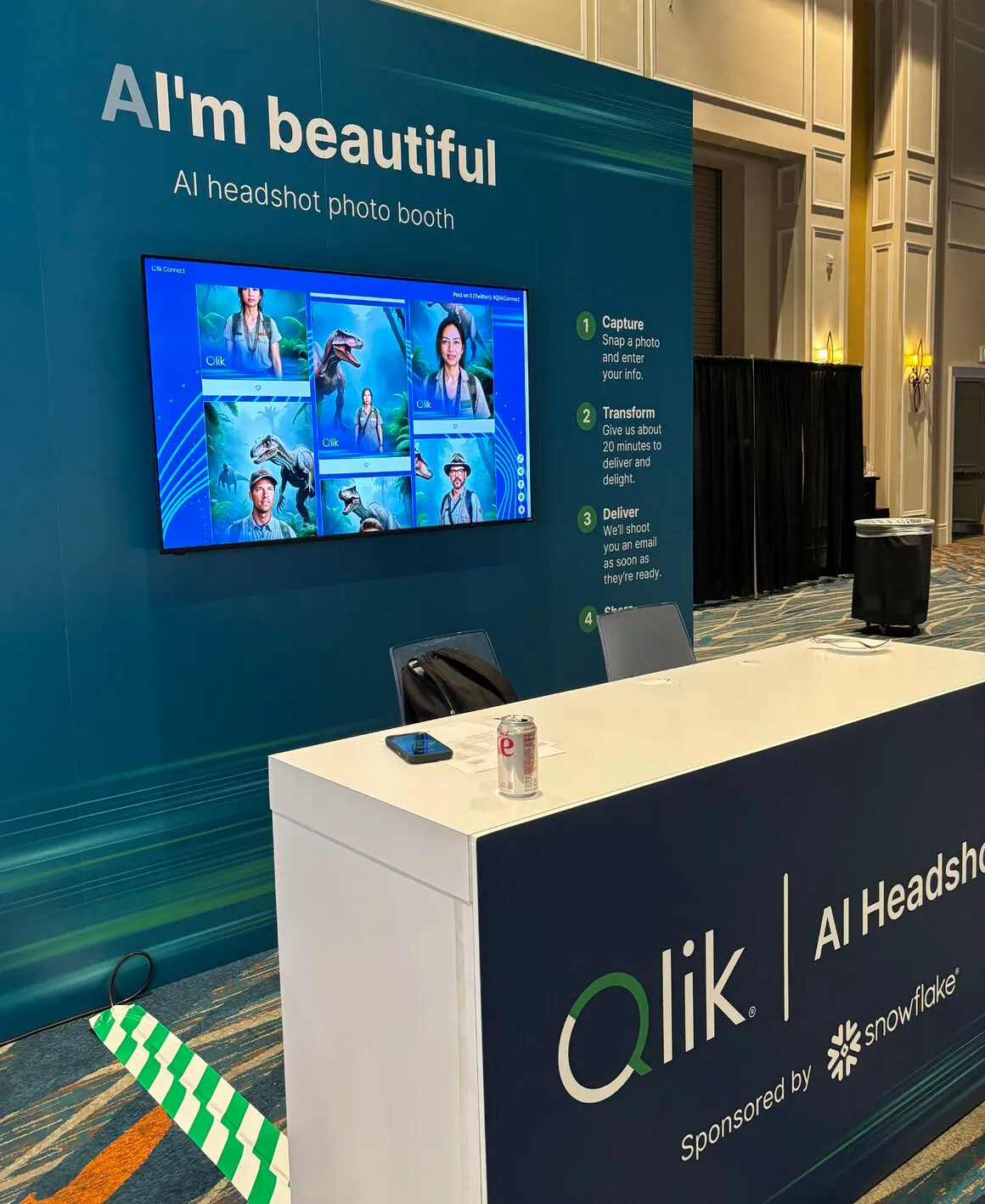 A custom branded event setup with a digital display screen showcasing AI photo booth content at a live event