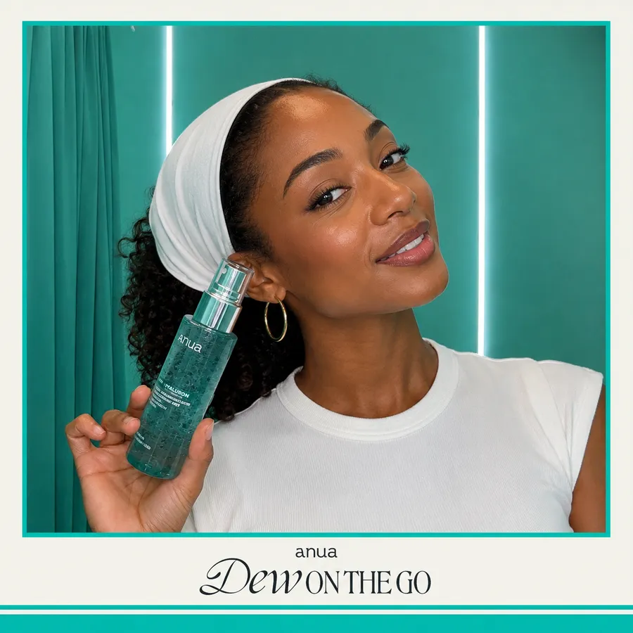 Photo booth snapshot of a guest holding an Anua skincare serum on a teal Dew On The Go frame