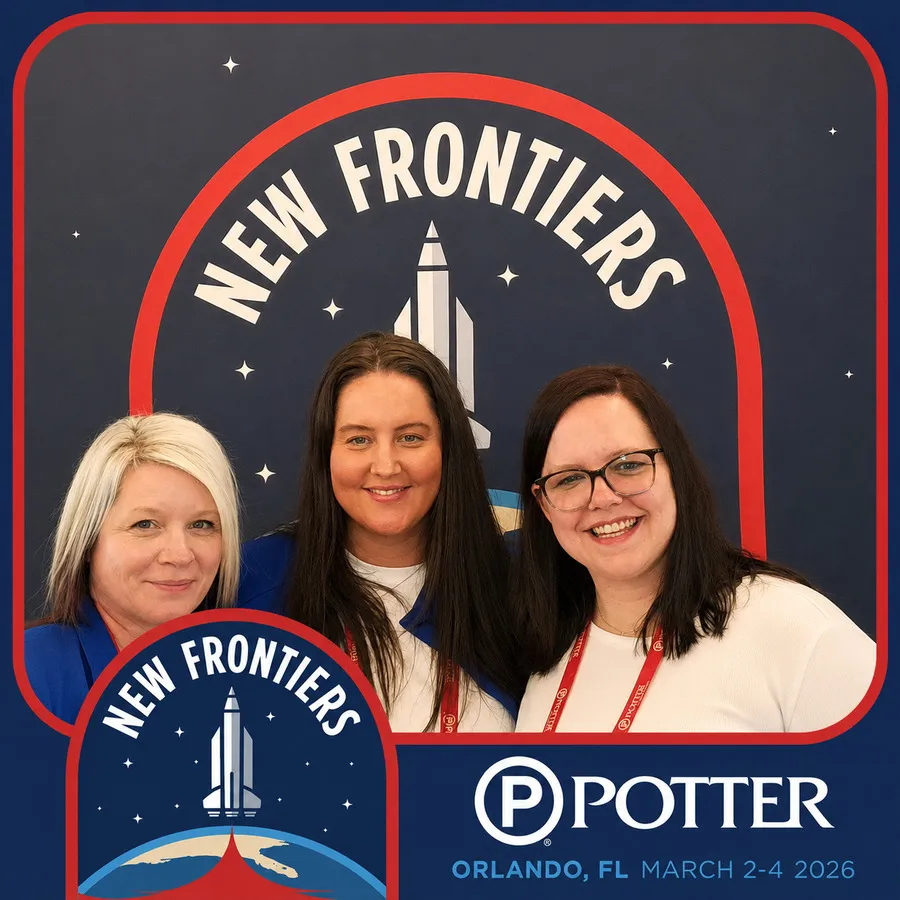 Photo booth snapshot of three guests on a Potter New Frontiers rocket frame in Orlando