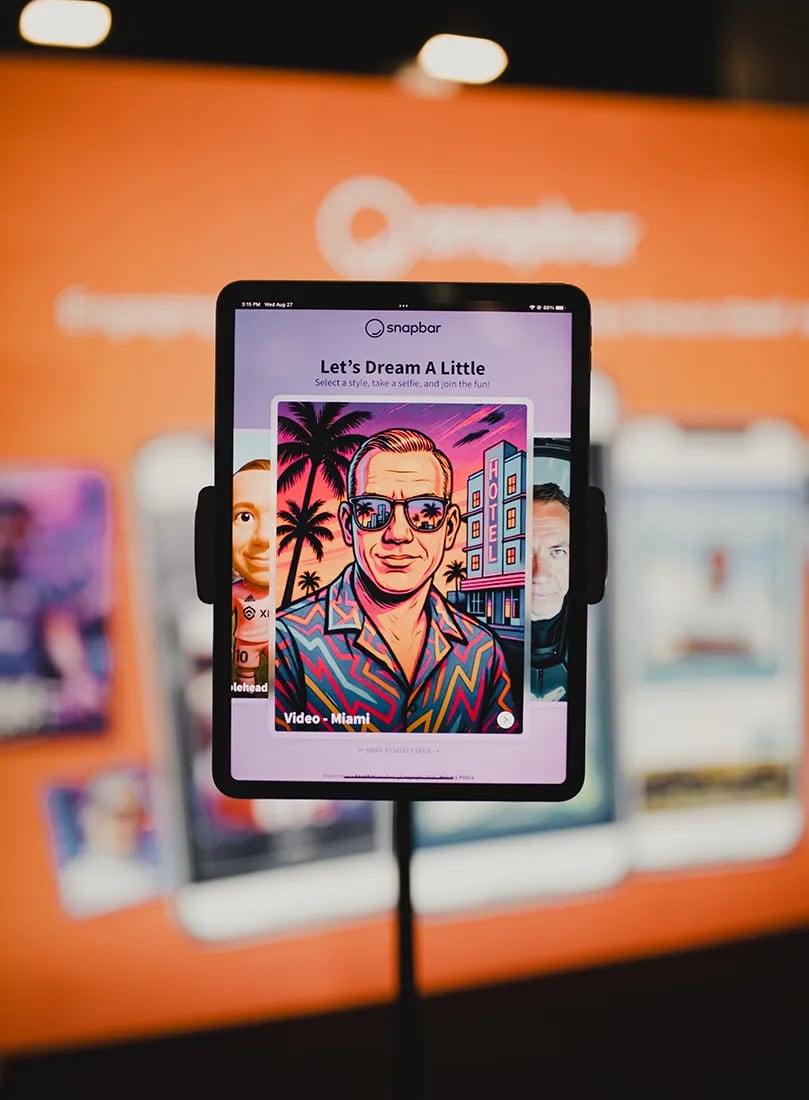 An iPad on a floor stand shows a style selection screen for an AI portrait experience in front of a blurred branded backdrop